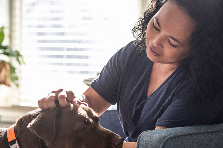 Woman petting dog