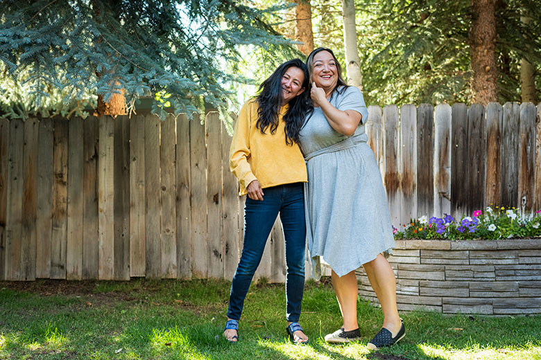 Two women embracing outside